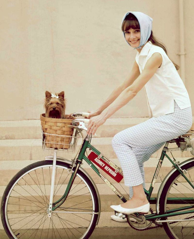 audrey hepburn wears a neckerchief on a bicycle